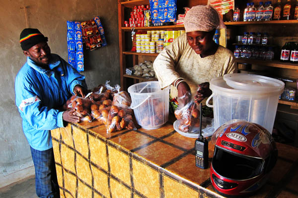 Buying donuts in Faradje, DRC